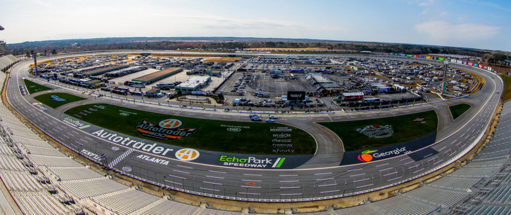 EchoPark Speedway at Atlanta showing the race logos painted in the infield grass.
